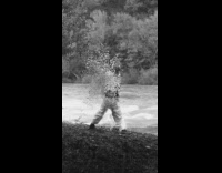 Man does a contemporary dance by the river