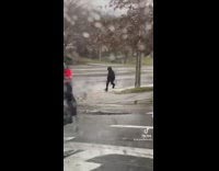 Girls in car record guy running with stick sword 