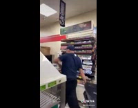 Flexible cashier dancing behind counter flips and spins