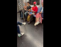 Man carries Chucky doll inside subway train