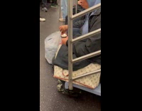 Collab Subway Creatures - Woman in train hold burning plastic container