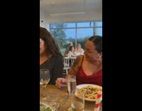 Two woman white top selfie duck face restaurant