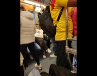Woman leans close at man inside train