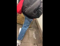 Passengers walk in flood inside subway station