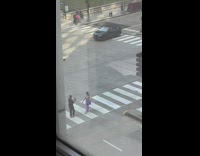 Girl purple bag and pants cross street