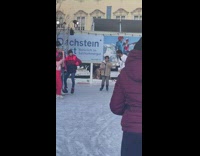 Guy skates with kid and both falls down 