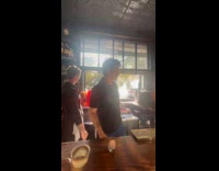 Loud motorcycle revving fills street with smoke