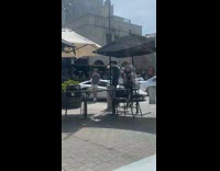 Collab IITW - Man in gray shirt leans on the white sports car