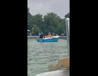 Woman bikini row boat on park lake