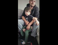 Man Helps Kid Puts on His Pants