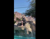 Man with a black crown selfie beside the slide