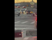 Car Moves Backward from Opposite Lane Towards Intersection