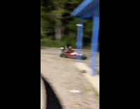 Guy drives GoKart into curb 