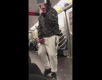 Pt. 2 Guy wears VR headset and dances on pole on subway train