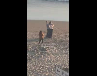 Couple hug right arm forward beach signage