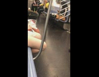 Old man yellow jacket plays dubstep music on speakers and head bops to music on subway train