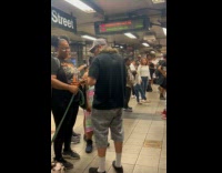 Man let woman touch snake on his shoulder