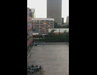 Guy smoke flare walk beside cargo train