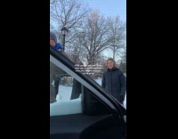 Parents rescuing daughters car stuck on snow