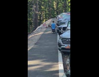 Blue shirt guy rowing machine parking lot 