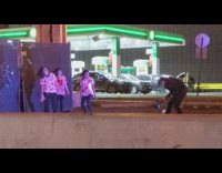 Three zombie women bloody shirt dance street