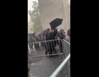 People running or taking cover from rain