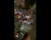 Collab winy - Man with flashlight direct traffic on street