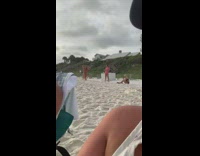 Bikini girl kneeling lunge beach sand overcast 