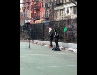 Two guys film dance video at court