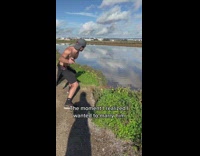Collab BitchMP - Shirtless guy skips rock over pond water