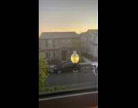 Girl dance on street car lamp pole