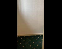 Man shows hotel fire escape without stairs