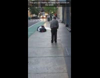 Blue Hawaiian shirt guy walks down sidewalk