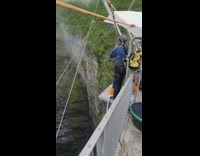 Black jacket guy bungee jumps white bridge 