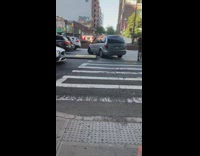 SUV car makes u turn on crosswalk 