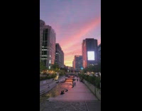 Takes video of the sunset at Seoul downtown