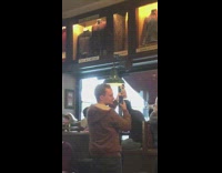 Guy photographs vase in restaurant 