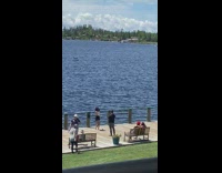 Woman in black skirt tiktok dance at the docks