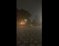 White shirt guy spins large metal cube 