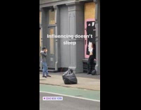 Girl boarded up building pink mural art