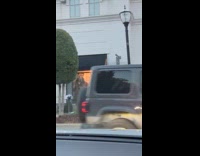 Three women tiktok dance near store window