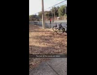 Two woman talk gossip tennis court