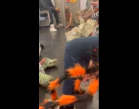 Kid lies down plays at subway floor