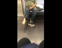 Man takes shoes off and stretches nasty foot on subway train, dirty long toenails