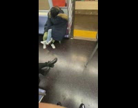 Couple embrace on train PDA adidas sneakers 
