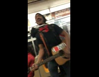 Man plays guitar and sings La Bamba loudly on subway