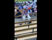 Collab IITW - Woman fan LA merch poses at stadium