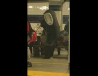 No face waits for train in subway station