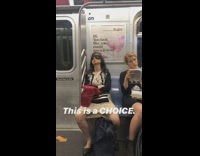 Woman sleeps with sleep mask over eyes on subway train