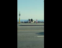 Woman violet dress butt lean sports car